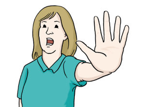 Eine Frau streckt ihre Hand nach vorne aus. Die Geste bedeutet: Halt! Stopp!